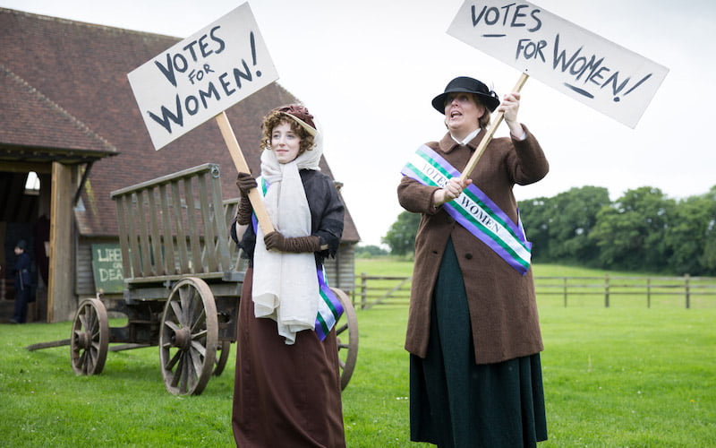 Two History Bombs Suffragettes protesting for voting rights on the set of the video 'Why did so many people protest during the Industrial Revolution?'