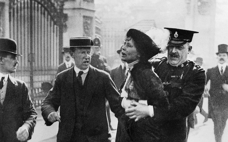 Suffragette Emmeline Pankhurst is arrested outside Buckingham Palace in England in 1914